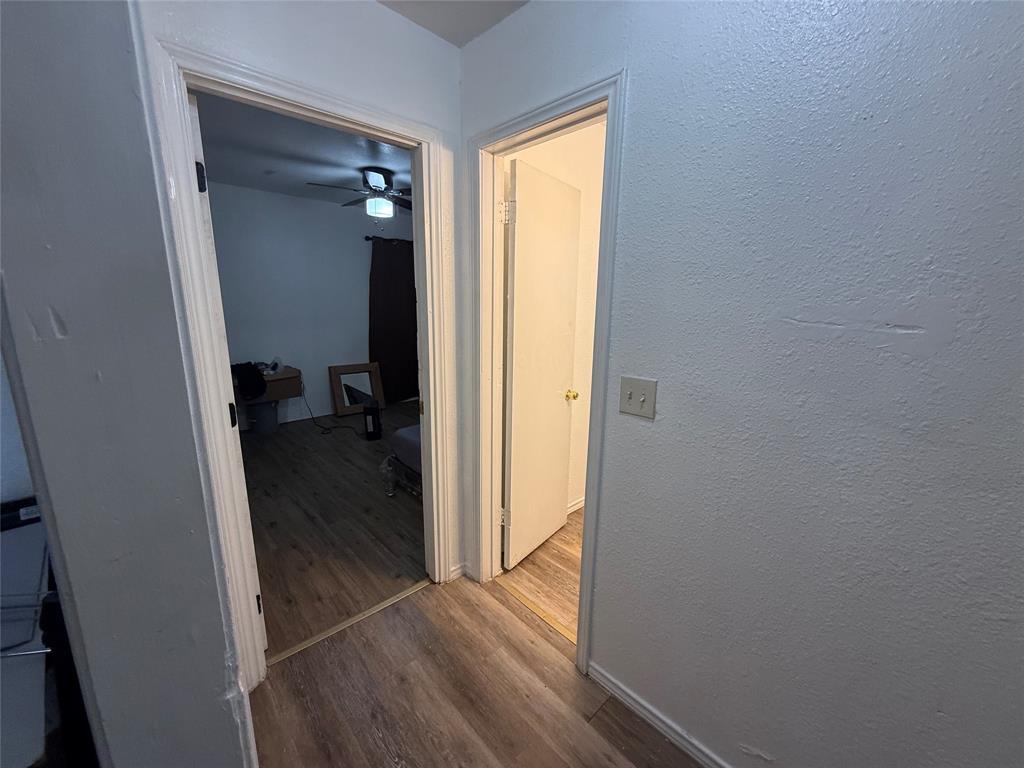 2912 Frazier Street Dallas, TX 75210 - Photo 8 of 36 a view of a hallway with wooden floor and closet