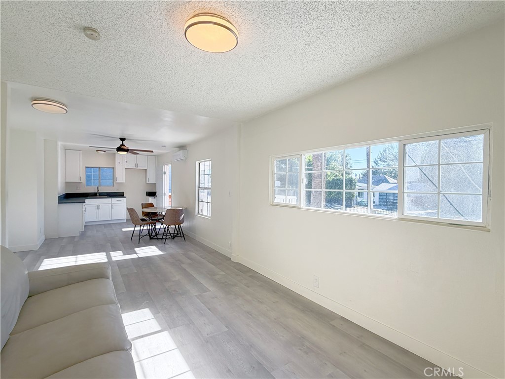 285 Parke Street Pasadena, CA 91101 - Photo 12 of 24 an empty room with furniture and windows