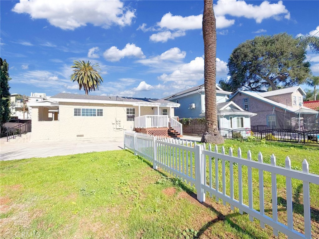 285 Parke Street Pasadena, CA 91101 - Photo 19 of 24 a view of a house with a swimming pool