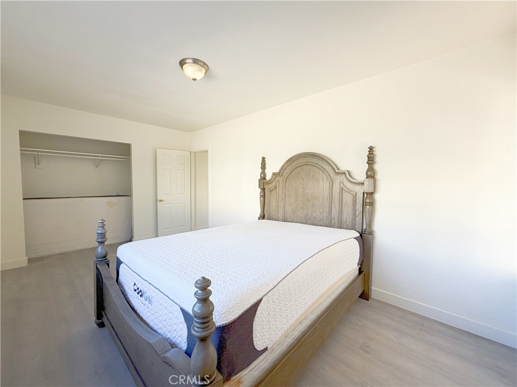 285 Parke Street Pasadena, CA 91101 - Photo 20 of 24 a bedroom with a bed and a dresser