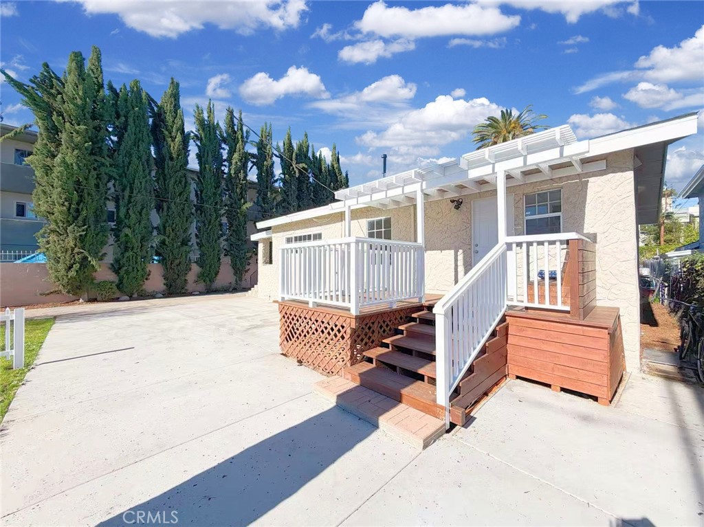 285 Parke Street Pasadena, CA 91101 - Photo 2 of 24 a view of a house with backyard and trees
