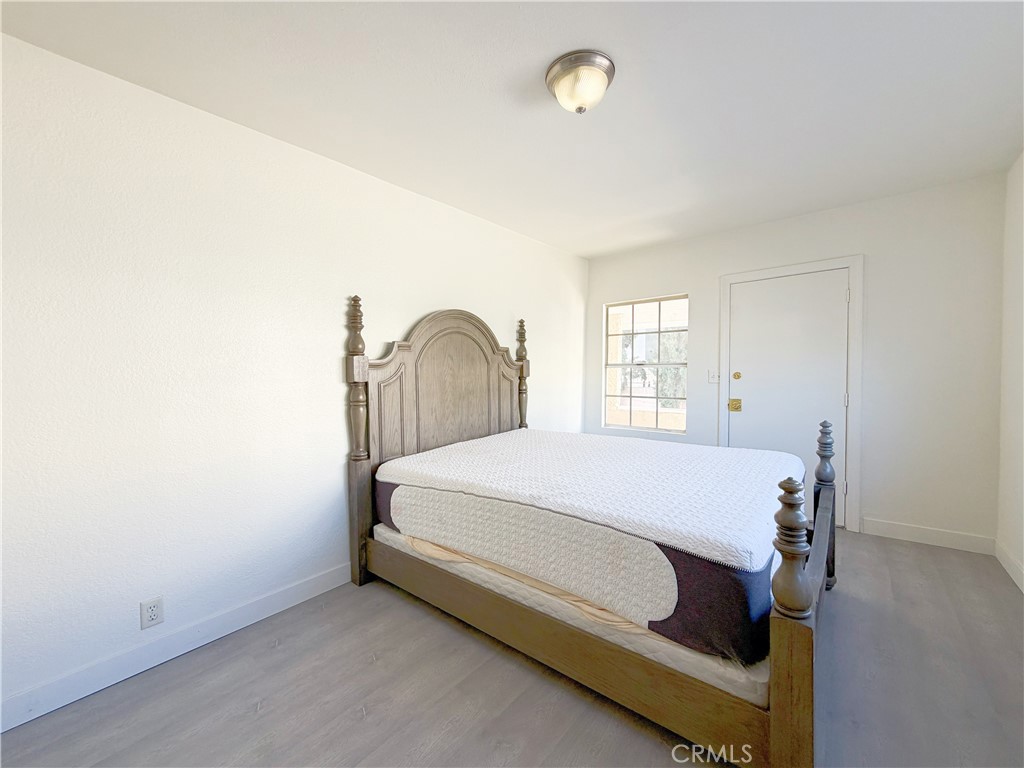 285 Parke Street Pasadena, CA 91101 - Photo 21 of 24 a bedroom with a bed and window