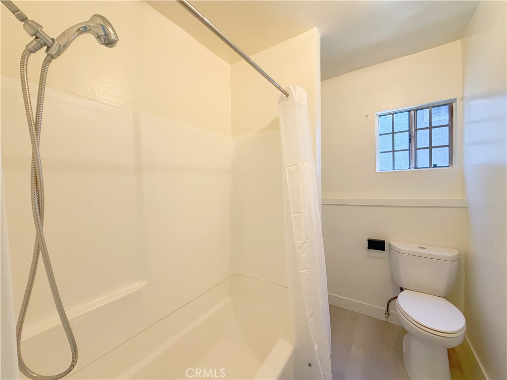 285 Parke Street Pasadena, CA 91101 - Photo 23 of 24 a bathroom with a toilet and a shower
