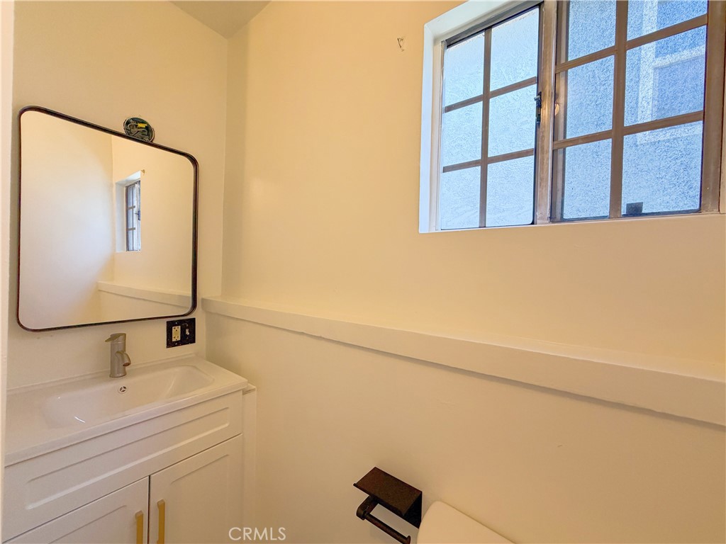 285 Parke Street Pasadena, CA 91101 - Photo 24 of 24 a bathroom with a sink and a mirror