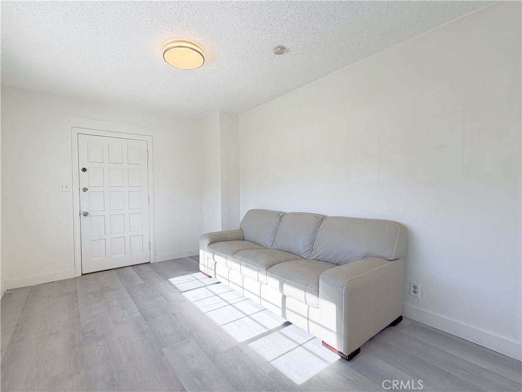 285 Parke Street Pasadena, CA 91101 - Photo 6 of 24 a living room with furniture and a window