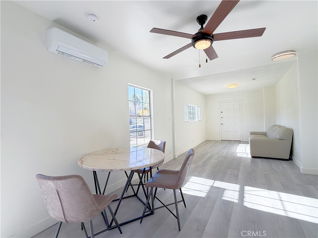 285 Parke Street Pasadena, CA 91101 - Photo 8 of 24 a view of a dining room with furniture and a window