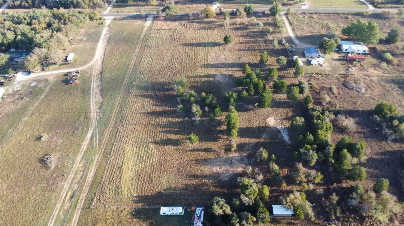 Lot 1 County Line Road Elgin, TX 78621 - Photo 4 of 12 Aerial view of property and surrounding area with farmland and rural landscape
