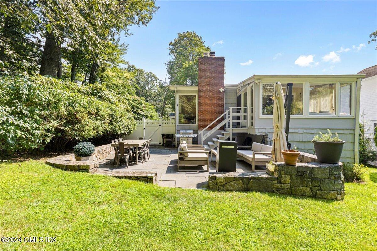 70 Gregory Road Cos Cob, CT 06807 - Photo 28 of 39 a view of a house with swimming pool and sitting area