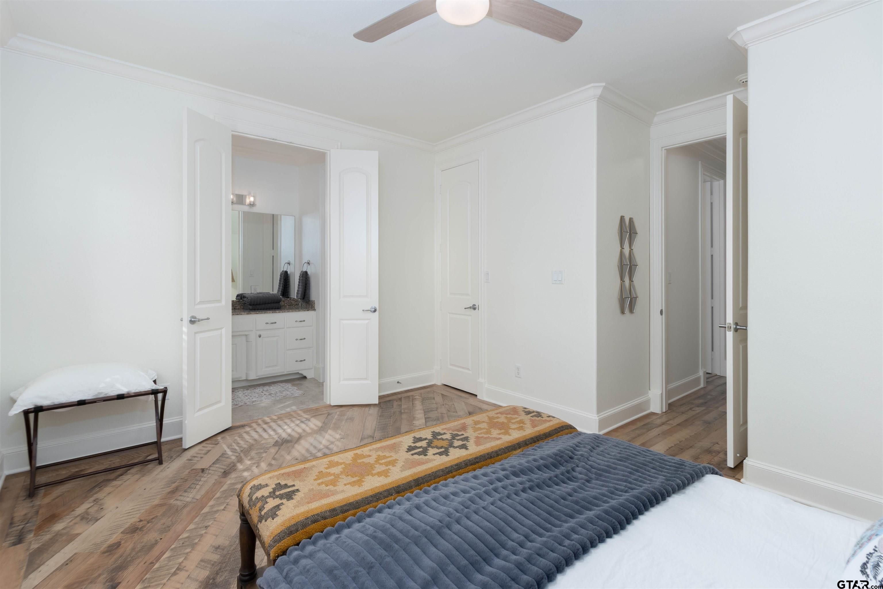 4534 Triggs Trace Tyler, TX 75709 - Photo 19 of 33 a bedroom with a bed and a hallway