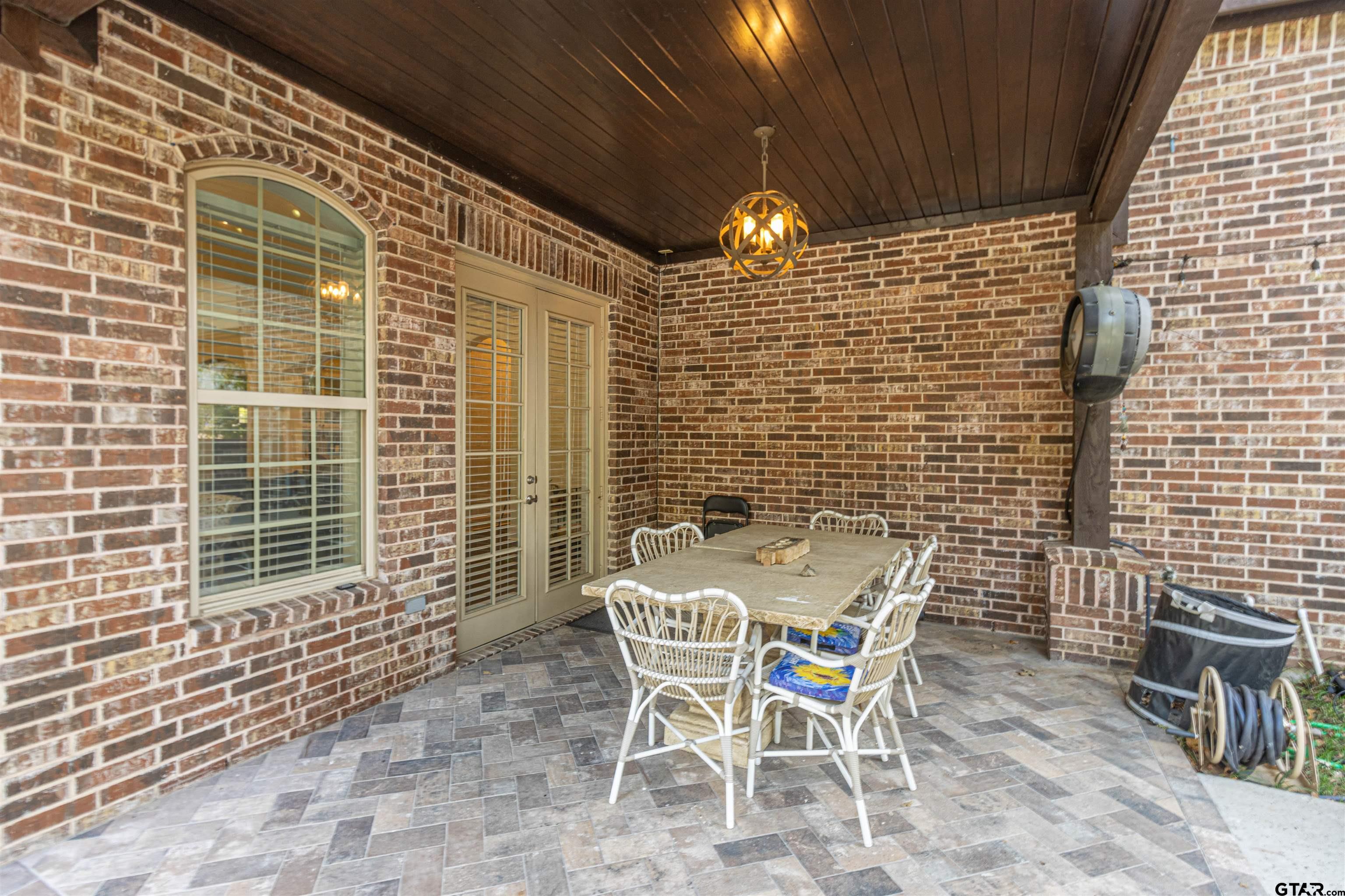 4534 Triggs Trace Tyler, TX 75709 - Photo 29 of 33 a patio with table and chairs and potted plants
