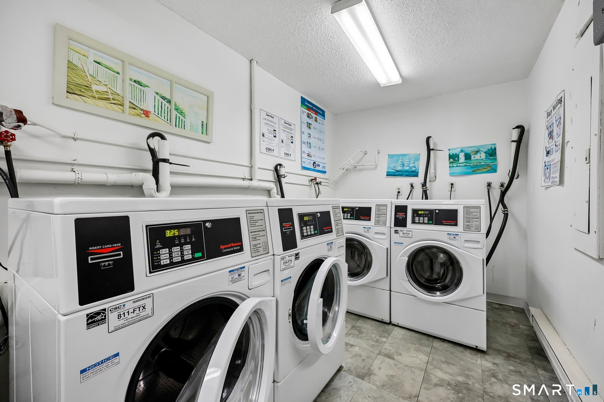 155 Short Beach Road, Unit 102 Stratford, CT 06615 - Photo 9 of 15 a utility room with dryer and washer
