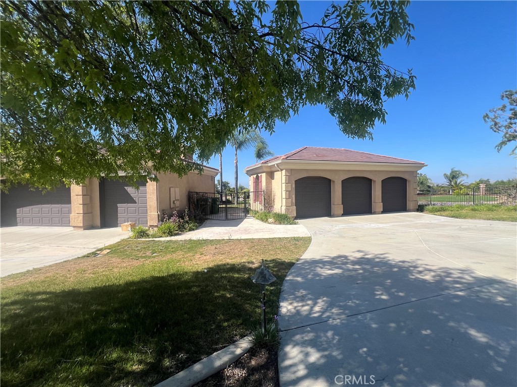 4069 Nancy Circle Corona, CA 92881 - Photo 12 of 73 a large tree in front of yellow house