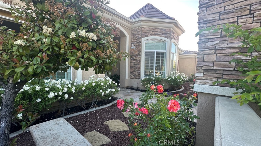 4069 Nancy Circle Corona, CA 92881 - Photo 17 of 73 a view of a house with a flower garden