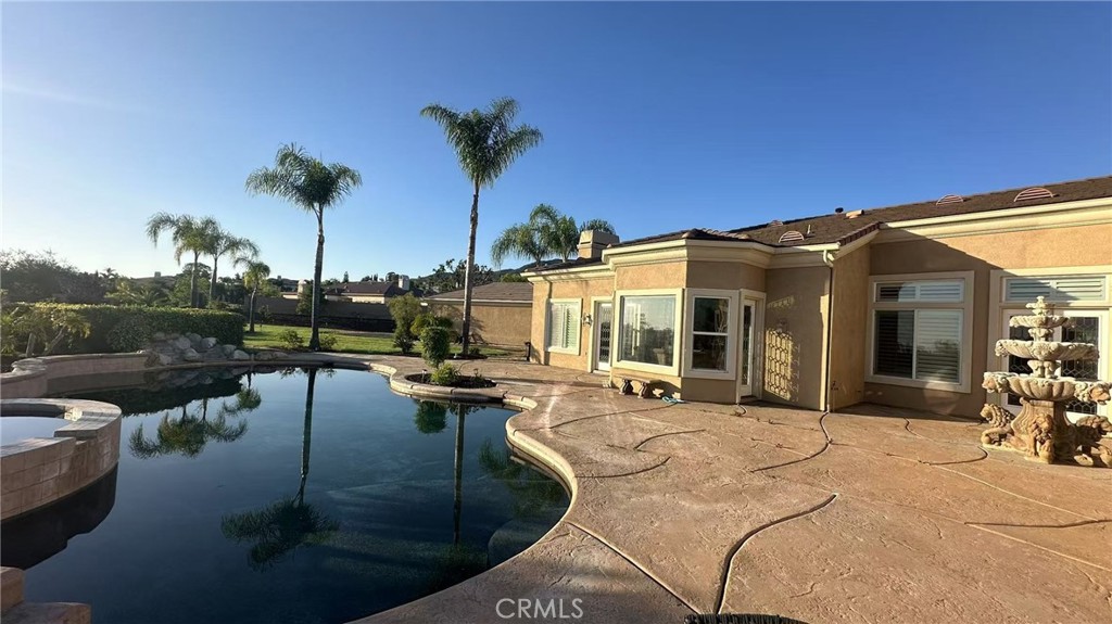 4069 Nancy Circle Corona, CA 92881 - Photo 21 of 73 a view of a house with backyard patio and swimming pool