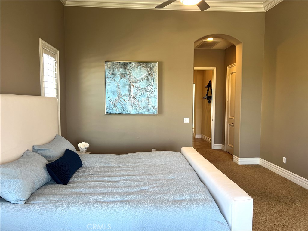 4069 Nancy Circle Corona, CA 92881 - Photo 43 of 73 a bedroom with a bed and a painting on the wall