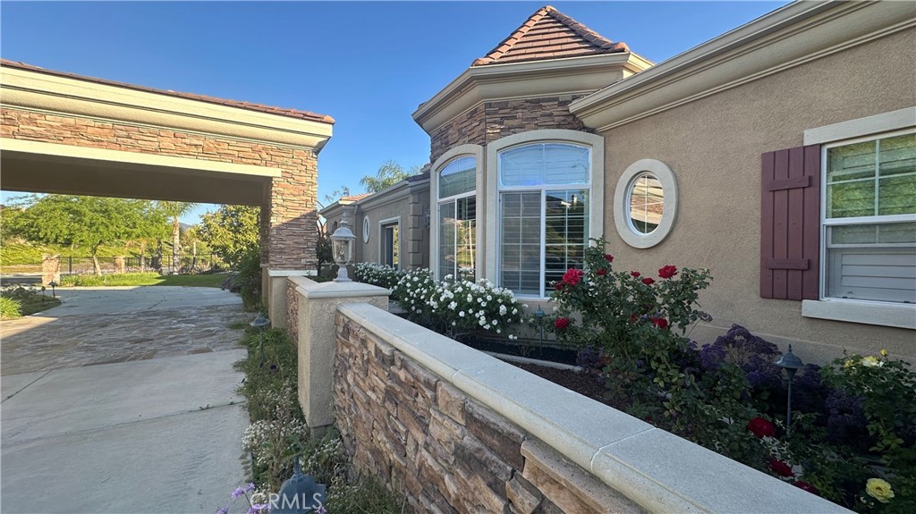 4069 Nancy Circle Corona, CA 92881 - Photo 5 of 73 a view of a house with a flower garden