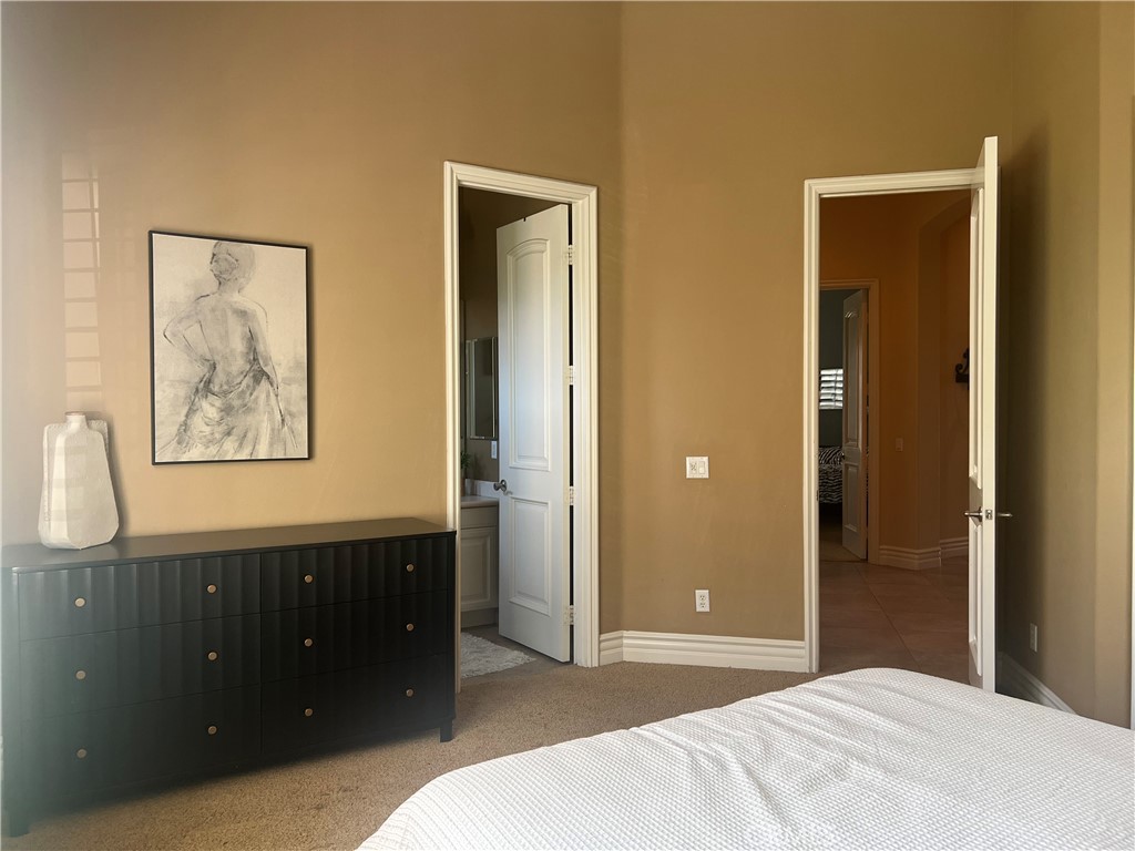 4069 Nancy Circle Corona, CA 92881 - Photo 52 of 73 a bedroom with a bed and a bathroom
