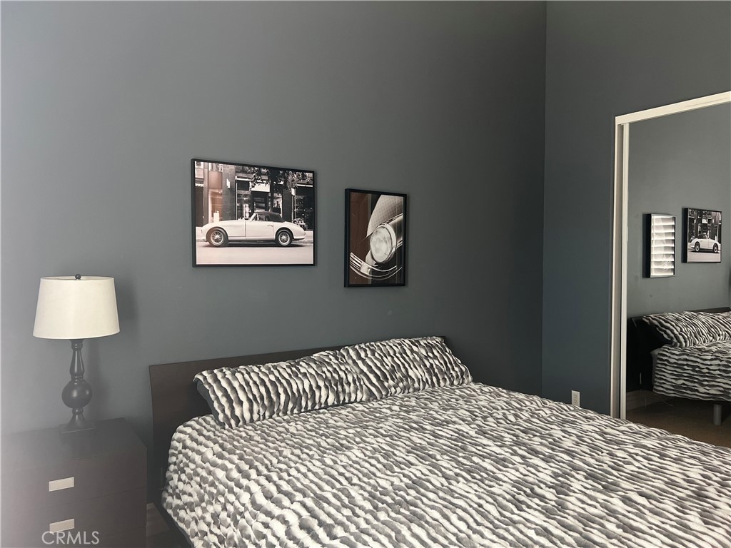 4069 Nancy Circle Corona, CA 92881 - Photo 57 of 73 a bedroom with a bed and a lamp on table