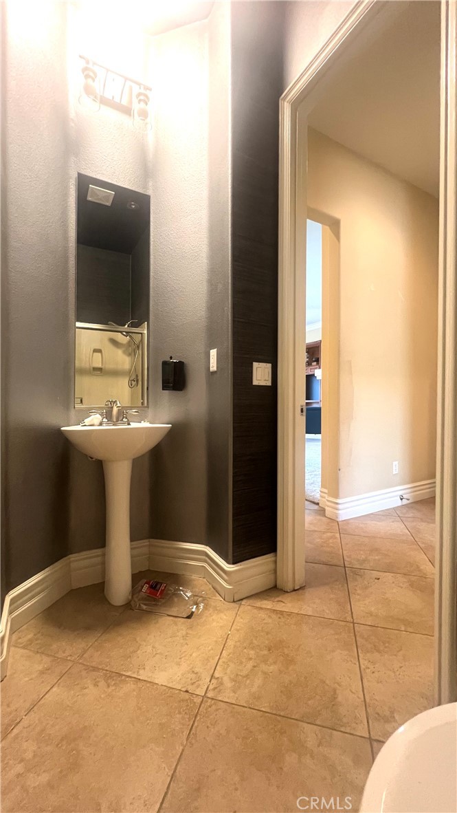 4069 Nancy Circle Corona, CA 92881 - Photo 60 of 73 a bathroom with a sink toilet and shower