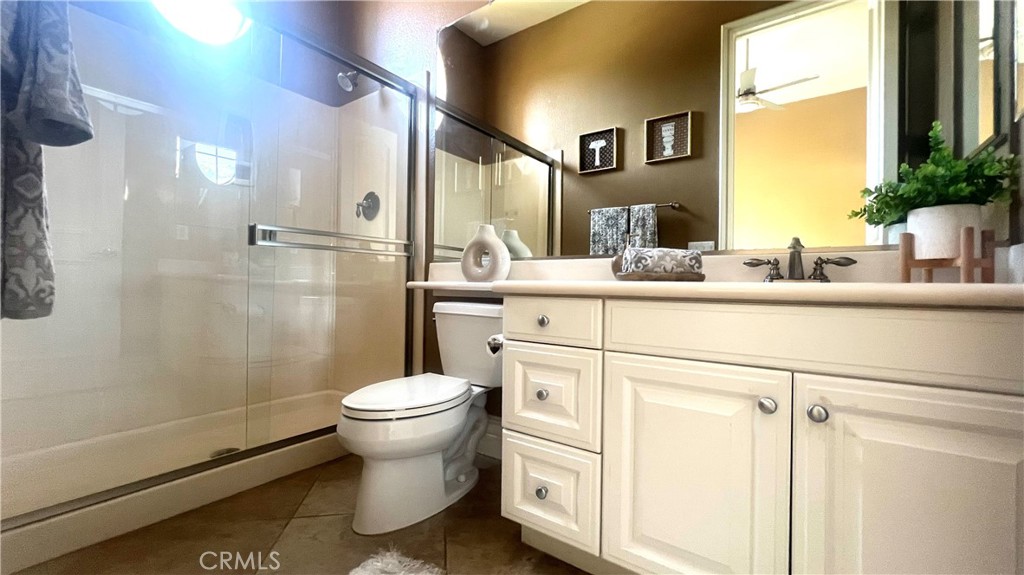 4069 Nancy Circle Corona, CA 92881 - Photo 66 of 73 a bathroom with a sink toilet and shower