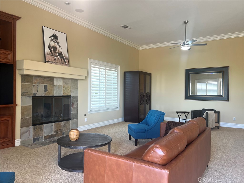 4069 Nancy Circle Corona, CA 92881 - Photo 67 of 73 a living room with furniture a window and a fireplace