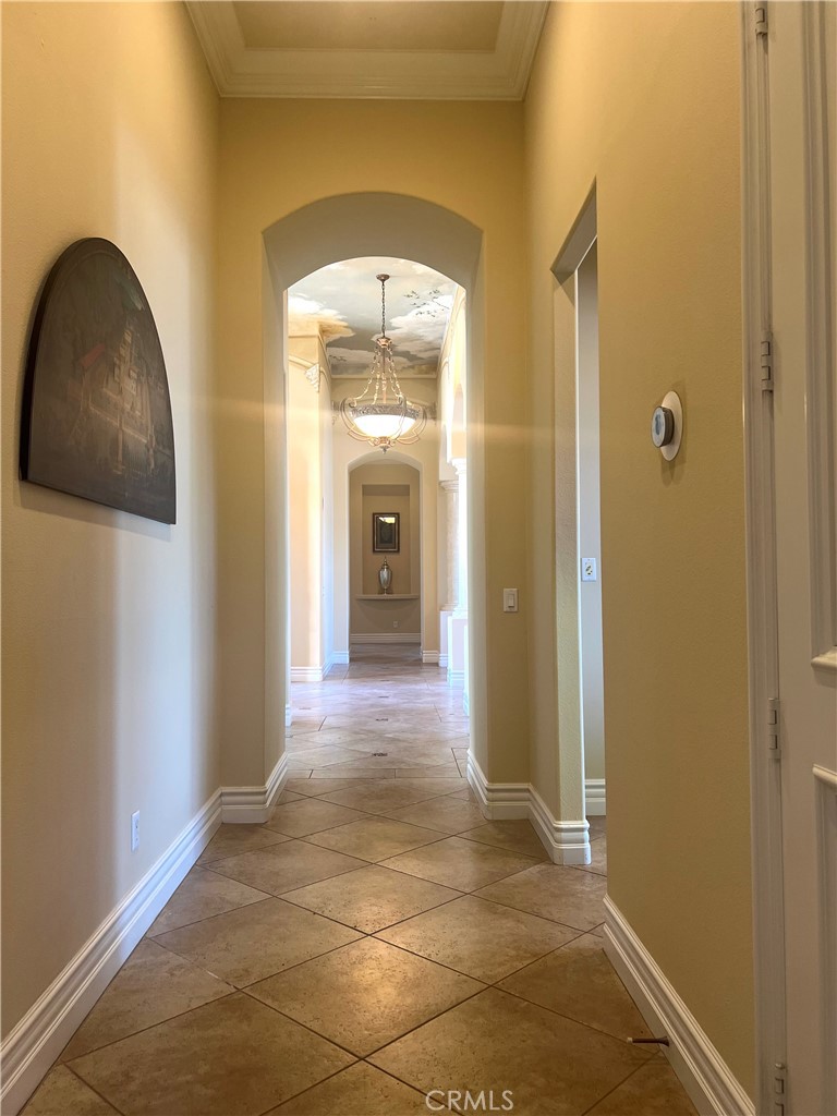 4069 Nancy Circle Corona, CA 92881 - Photo 70 of 73 a view of a hallway with wooden floor and a bathroom