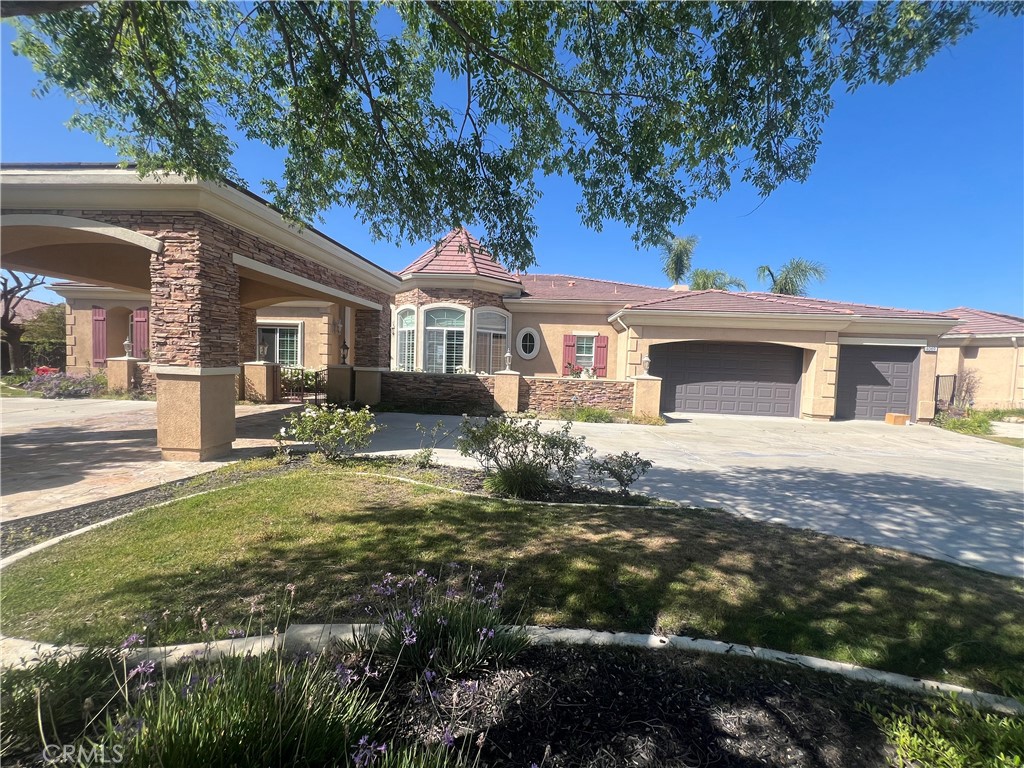 4069 Nancy Circle Corona, CA 92881 - Photo 7 of 73 a front view of a house with garden