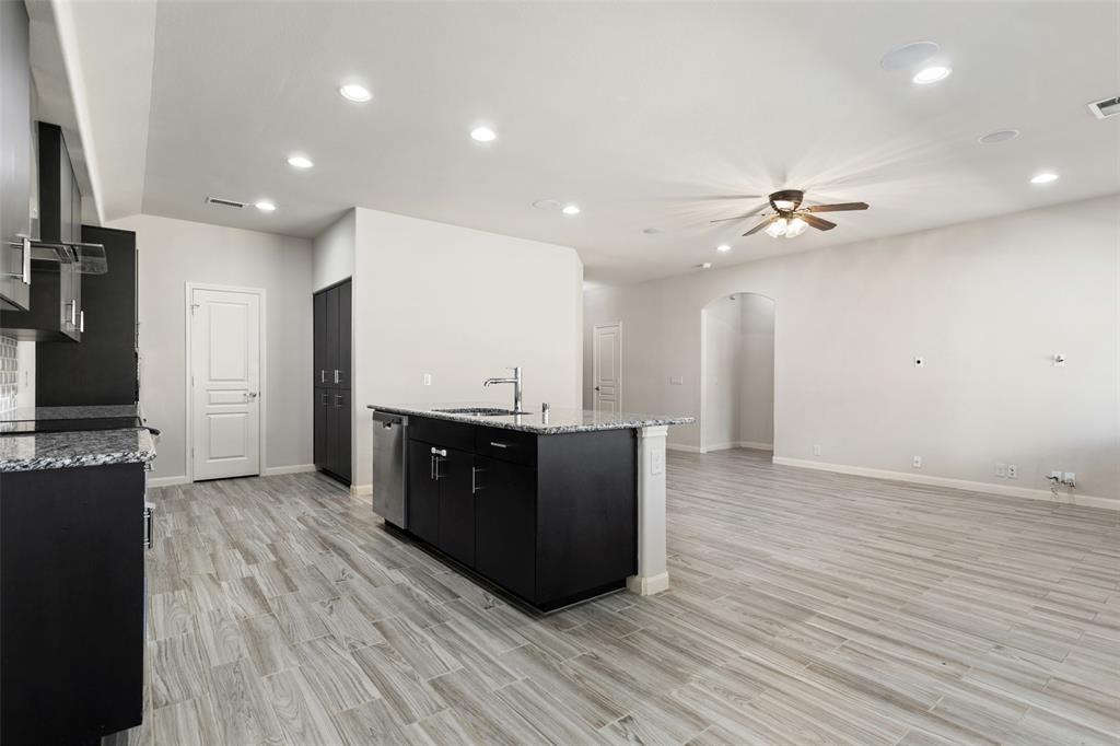 816 Harrison Lane Lavon, TX 75166 - Photo 12 of 40 a living room with hard wood floors and a flat screen tv