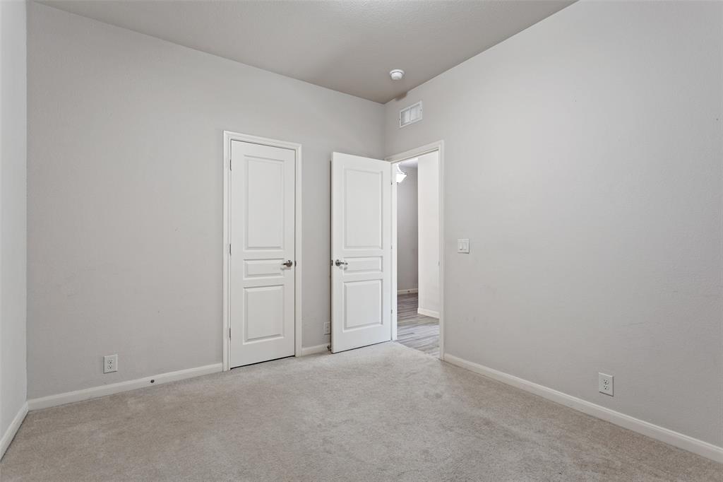 816 Harrison Lane Lavon, TX 75166 - Photo 23 of 40 an empty room with closet area