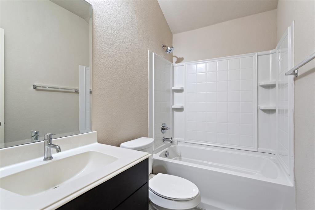 816 Harrison Lane Lavon, TX 75166 - Photo 26 of 40 a bathroom with a sink a toilet and shower