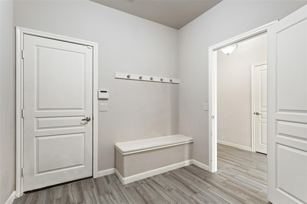 816 Harrison Lane Lavon, TX 75166 - Photo 27 of 40 a bathroom with a wooden floor