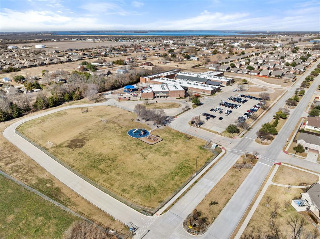 816 Harrison Lane Lavon, TX 75166 - Photo 40 of 40 an aerial view of residential houses with outdoor space