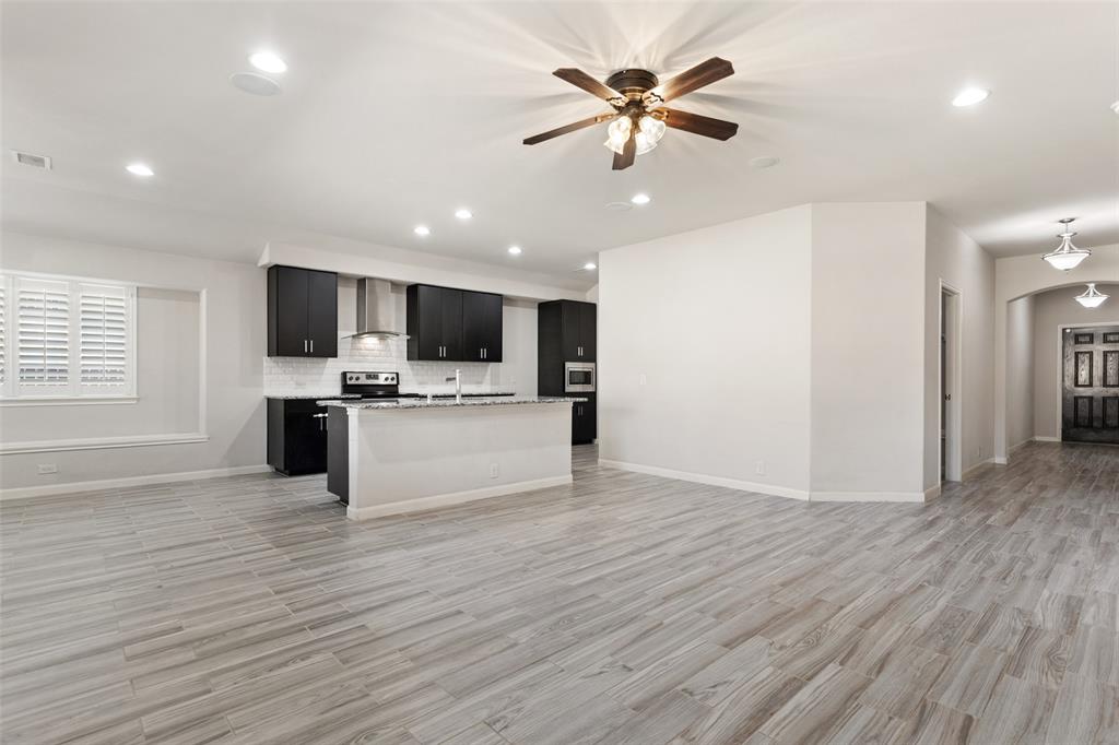 816 Harrison Lane Lavon, TX 75166 - Photo 6 of 40 a view of kitchen with microwave and refrigerator