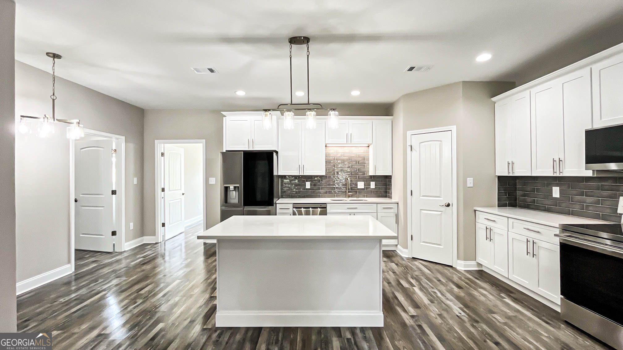 2011 Griffin Road Macon, GA 31216 - Photo 13 of 64 a large kitchen with stainless steel appliances a large center island attached withe living room