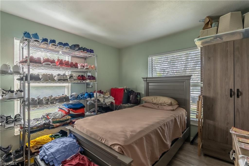 1360 5th Avenue North Naples, FL 34102 - Photo 12 of 45 a bedroom with a bed and a window