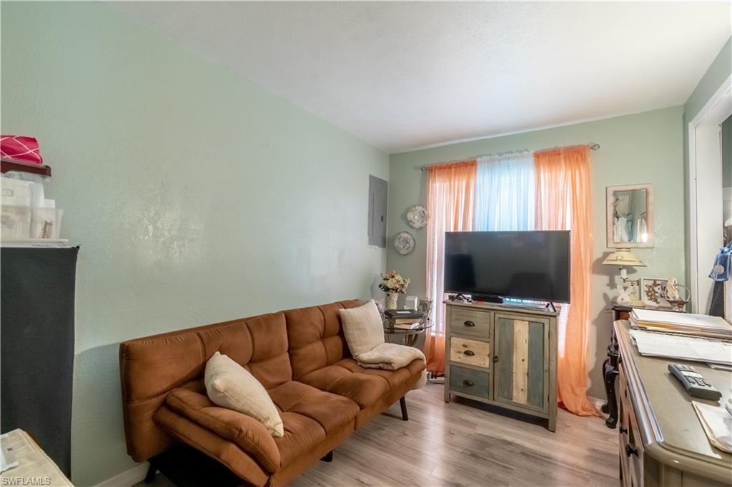 1360 5th Avenue North Naples, FL 34102 - Photo 14 of 45 a living room with furniture and a flat screen tv