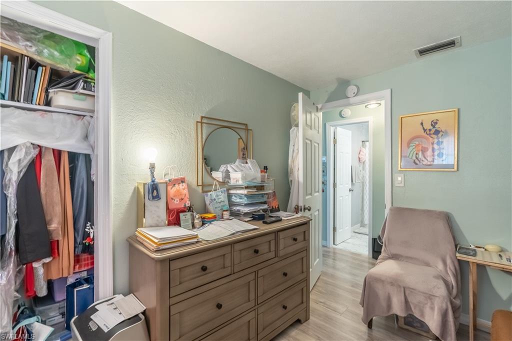 1360 5th Avenue North Naples, FL 34102 - Photo 15 of 45 a room with furniture and a flat screen tv