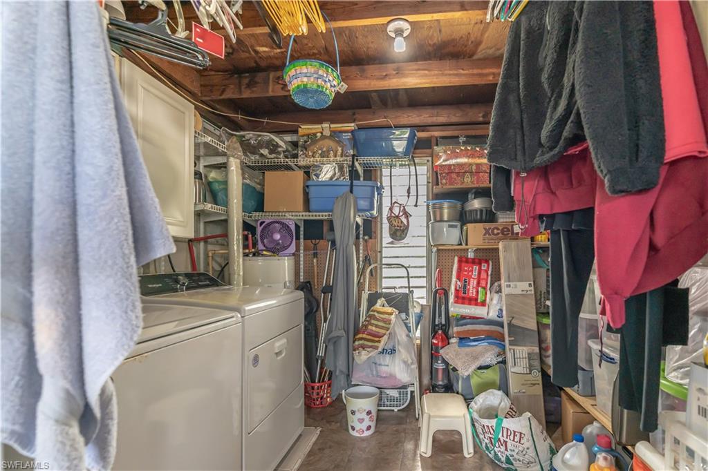 1360 5th Avenue North Naples, FL 34102 - Photo 19 of 45 a view of walk in closet with clothes