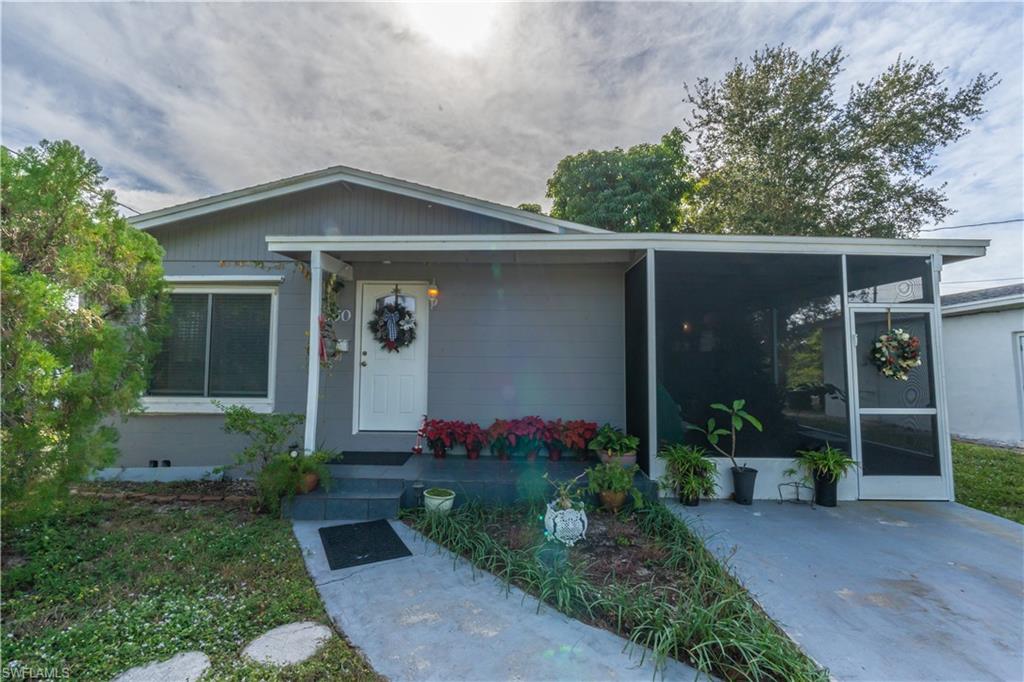 1360 5th Avenue North Naples, FL 34102 - Photo 21 of 45 front view of a house with a yard
