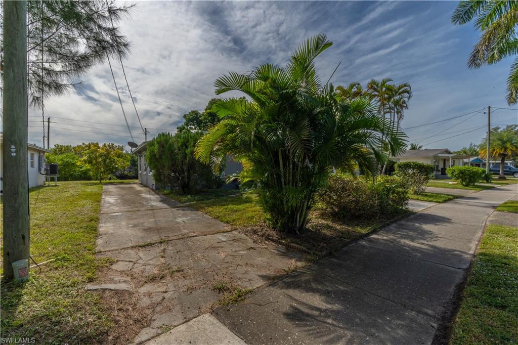1360 5th Avenue North Naples, FL 34102 - Photo 28 of 45 a view of a yard with plants and trees
