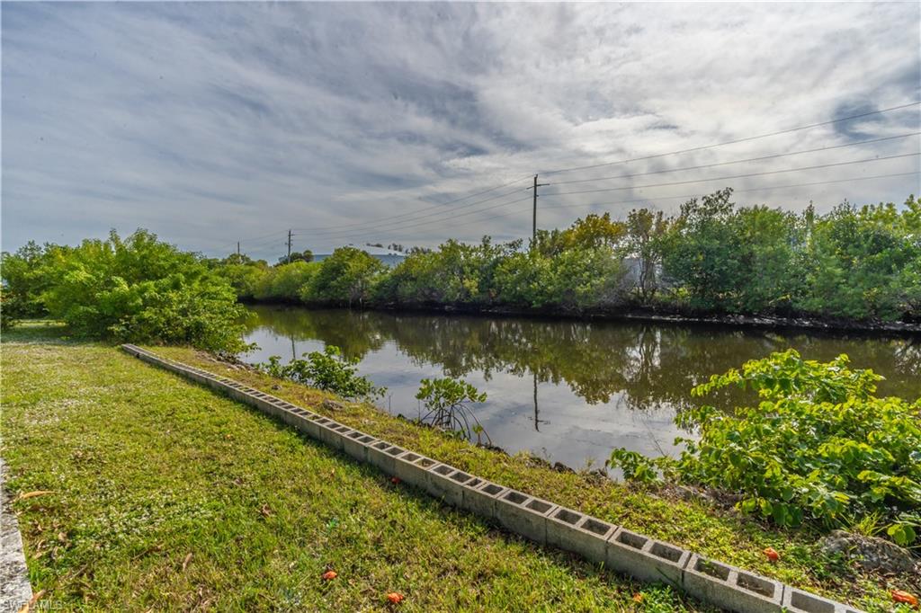 1360 5th Avenue North Naples, FL 34102 - Photo 30 of 45 a view of a lake with a yard