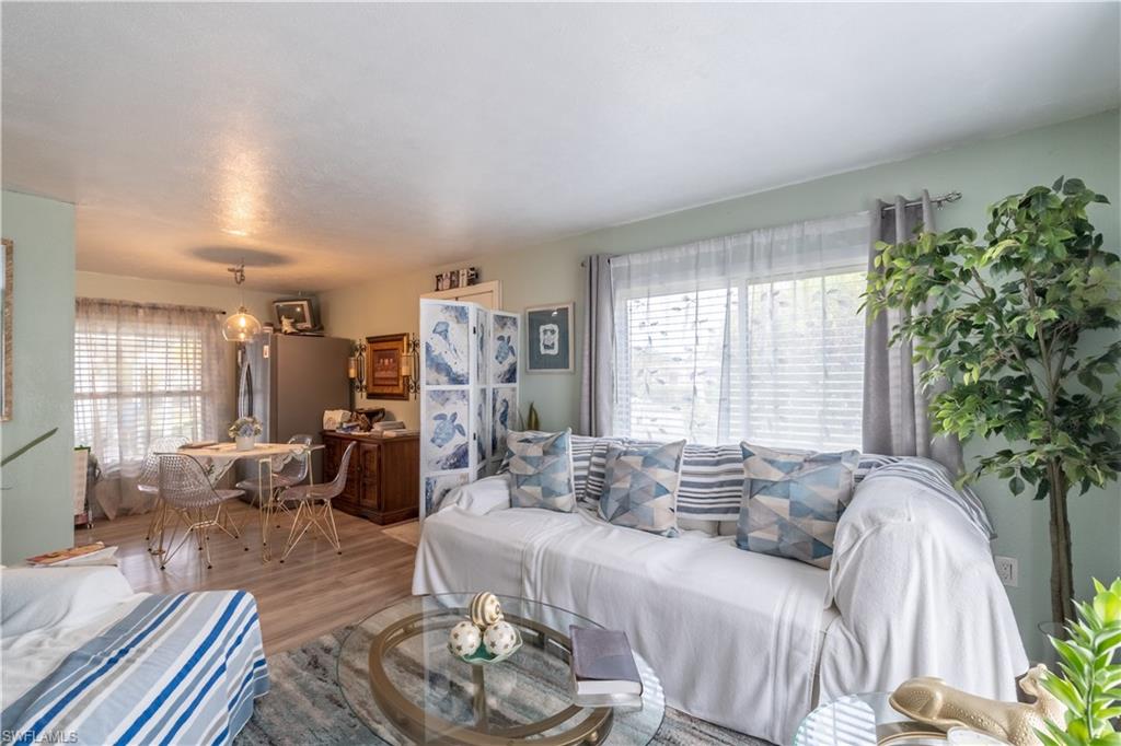 1360 5th Avenue North Naples, FL 34102 - Photo 3 of 45 a living room with furniture and a large window