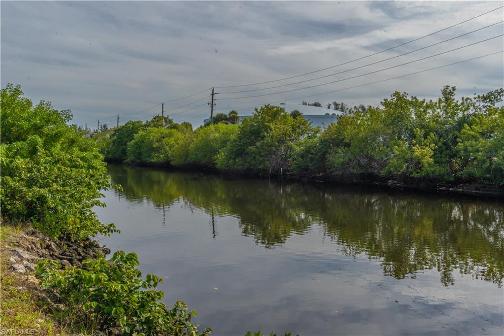 1360 5th Avenue North Naples, FL 34102 - Photo 32 of 45 a view of a lake with a building in the background