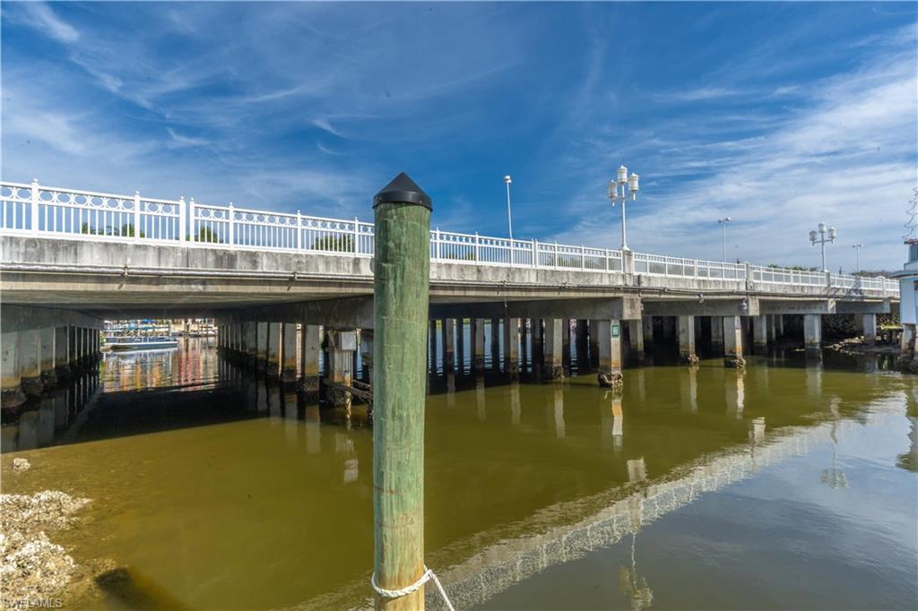 1360 5th Avenue North Naples, FL 34102 - Photo 38 of 45 a view of a swimming pool with an outdoor seating