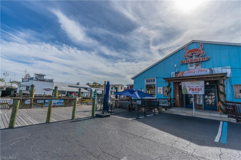 1360 5th Avenue North Naples, FL 34102 - Photo 43 of 45 a view of a living room roof and furniture