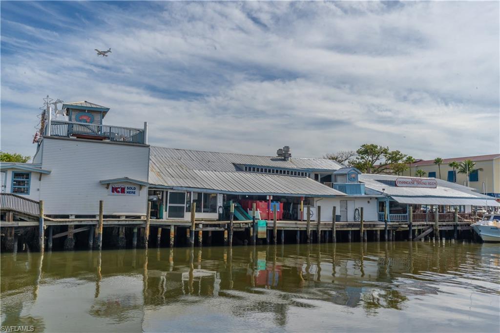 1360 5th Avenue North Naples, FL 34102 - Photo 45 of 45 a view of house with swimming pool and lake view