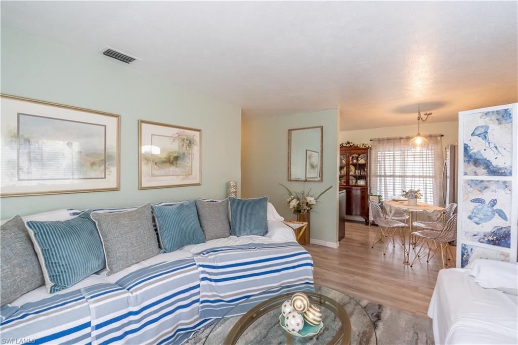 1360 5th Avenue North Naples, FL 34102 - Photo 5 of 45 a living room with furniture and wooden floor