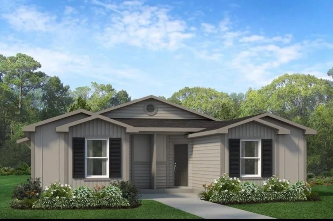 front view of a house with a yard