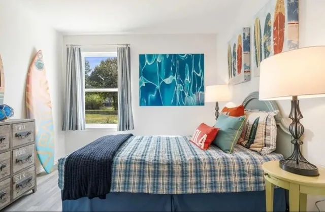 a bedroom with a bed and a window