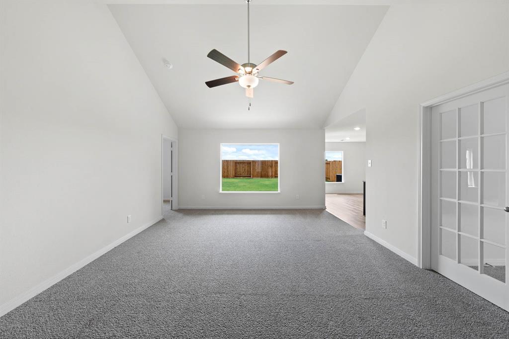 13404 Gitty Up Circle Cresson, TX 76035 - Photo 4 of 7 a view of a livingroom with a ceiling fan and window